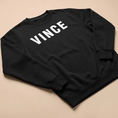 Bold typography t-shirt featuring the phrase The Color Of Money with money graphics in green, black, and white. — printed on a unisex sweatshirt