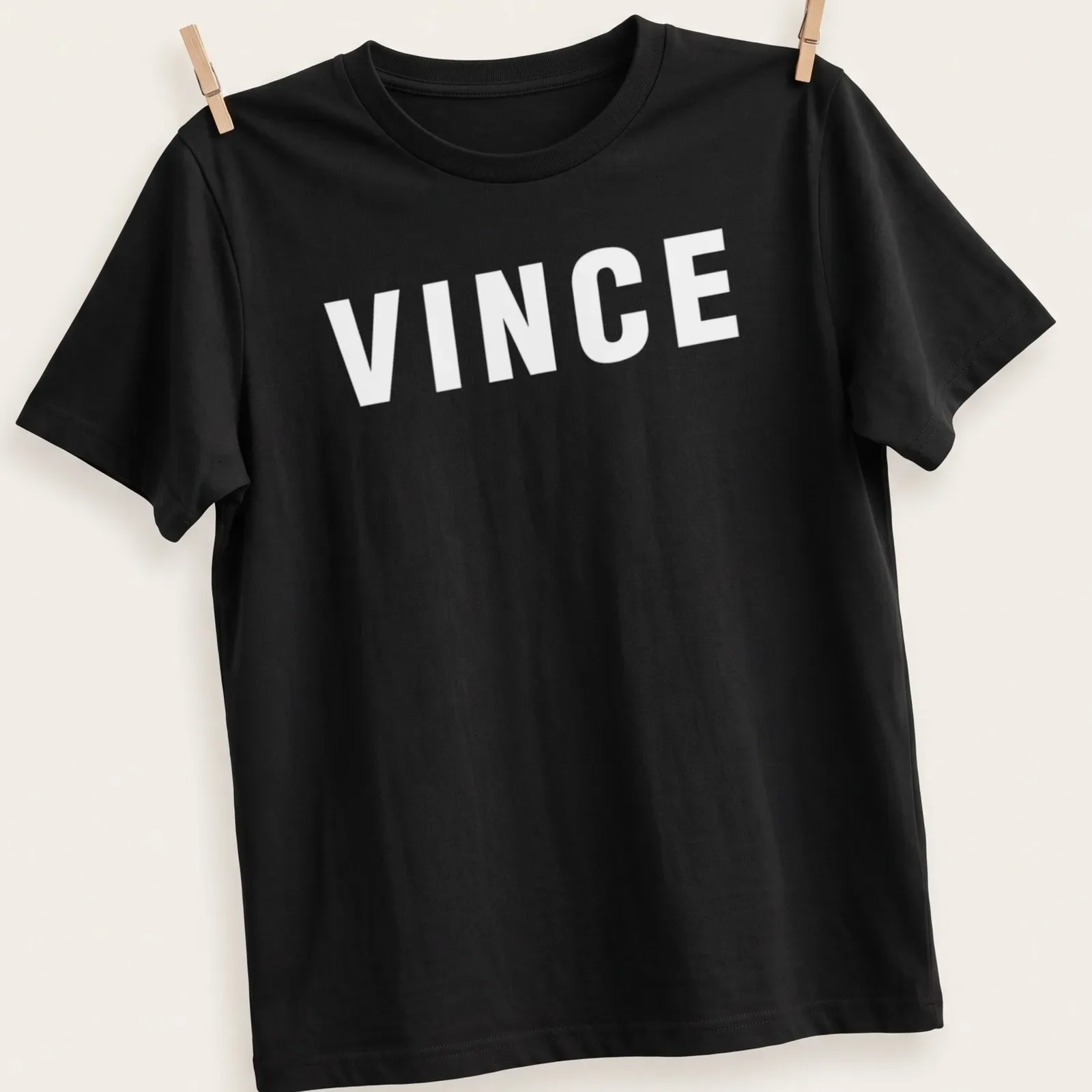 Bold typography t-shirt featuring the phrase The Color Of Money with money graphics in green, black, and white. — printed on a unisex t-shirt
