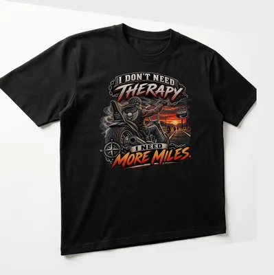 Bold graphic motorcycle t-shirt with the text about therapy and miles — printed on a unisex t-shirt (angled view)