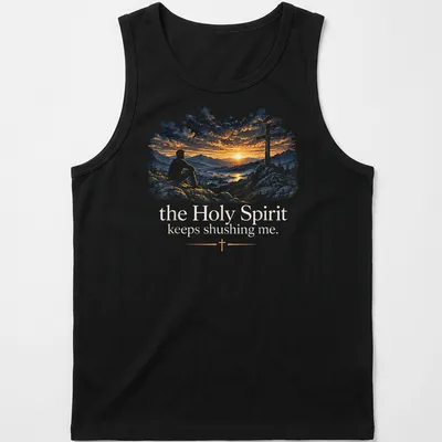 A serene illustration of a man on rocks at sunset with cross and text about the Holy Spirit — printed on a tank top