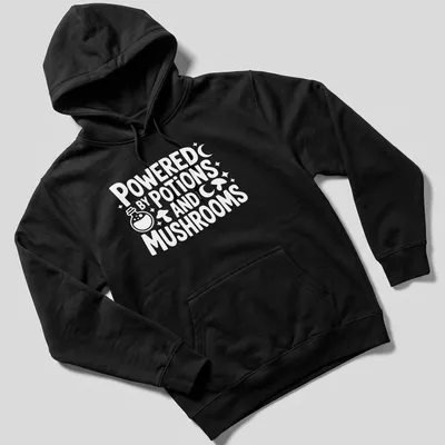 Whimsical print featuring mushrooms and potions with the text 'Powered By Potions And Mushrooms' — printed on a unisex hoodie