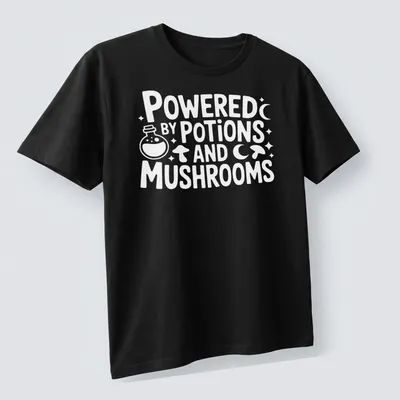 Whimsical print featuring mushrooms and potions with the text 'Powered By Potions And Mushrooms' — printed on a unisex t-shirt (angled view)