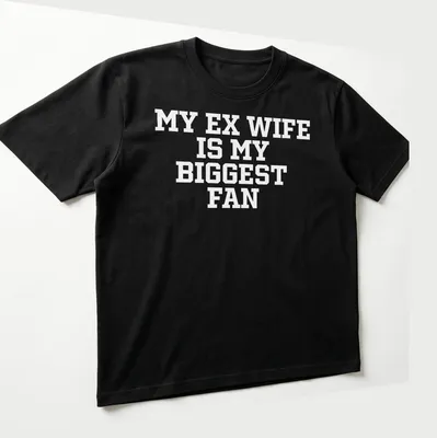Bold typography t-shirt with the phrase 'My Ex Wife Is My Biggest Fan' — printed on a unisex t-shirt (angled view)
