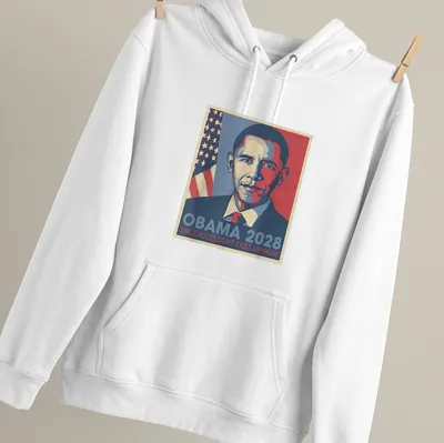 Retro t-shirt with the text 'Obama 2028 Since Rules Don't Exist Anymore' in blue, red, and white — printed on a unisex hoodie