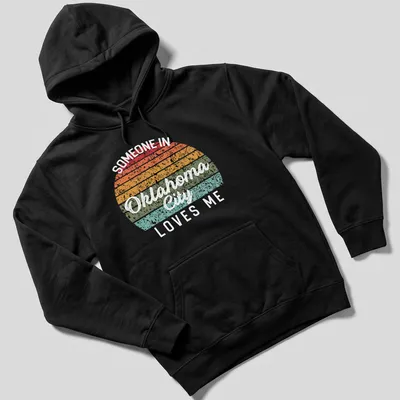 Retro distressed t-shirt with the phrase 'Someone in Oklahoma City Loves Me' in bright colors — printed on a unisex hoodie