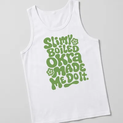 Playful typography t-shirt featuring okra-themed humor in green bubble letters — printed on a tank top