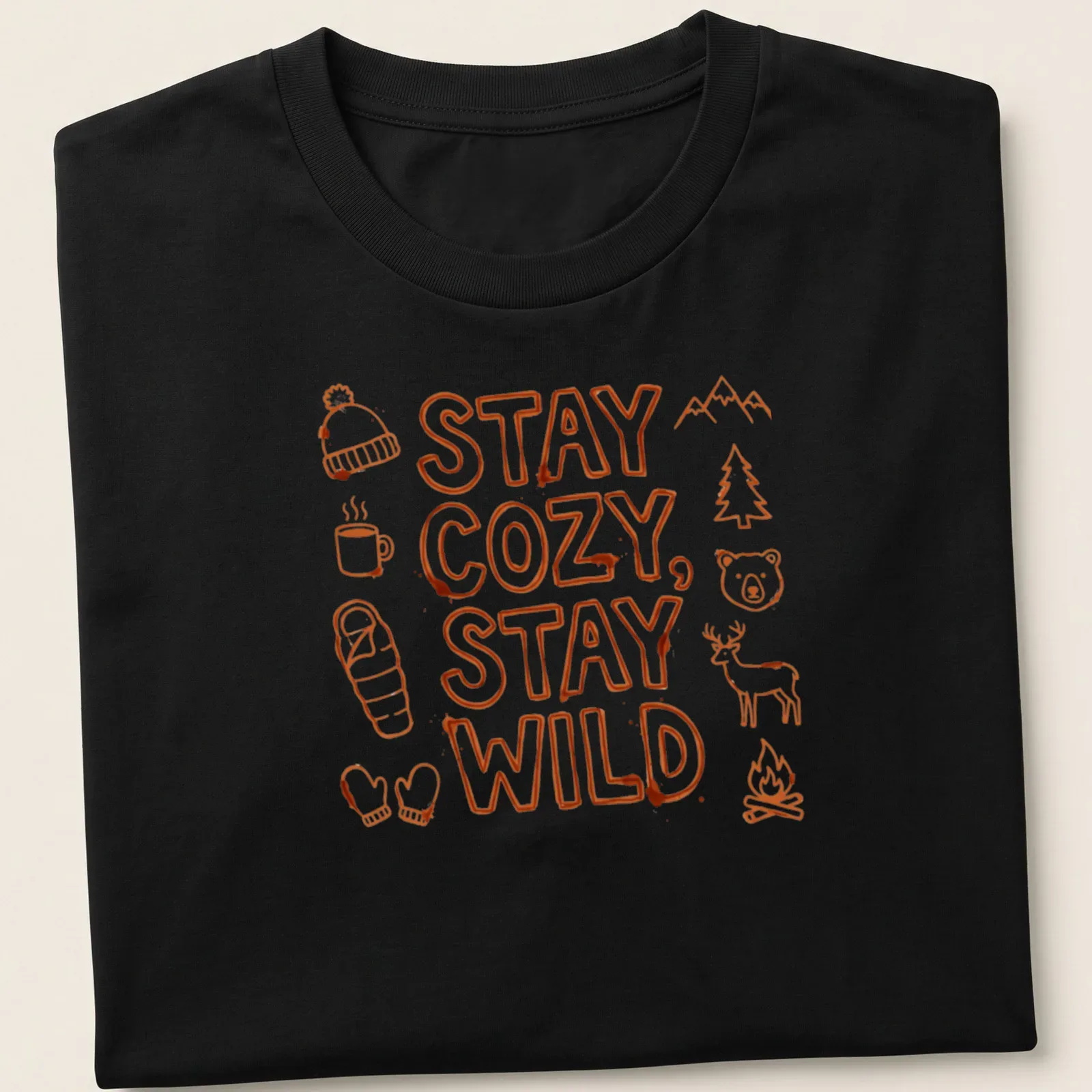 Doodle art shirt with camping elements and the text Stay Cozy, Stay Wild in bright orange and white — printed on a unisex t-shirt