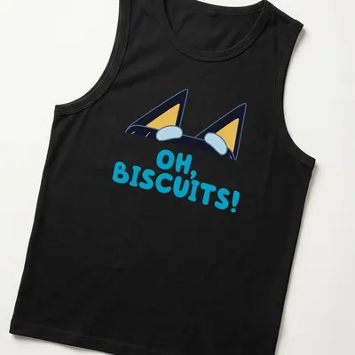 Cartoon design of peeking dog ears with text reading 'OH, BISCUITS!' in various colors — printed on a tank top