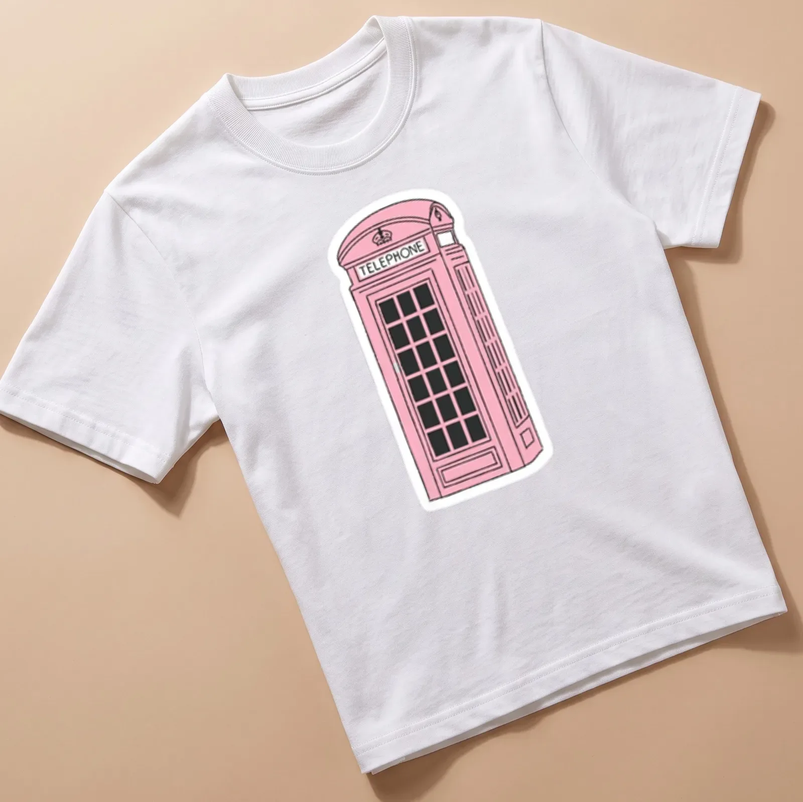 Illustration of a pink London phone booth with the word 'TELEPHONE' above it — printed on a unisex t-shirt