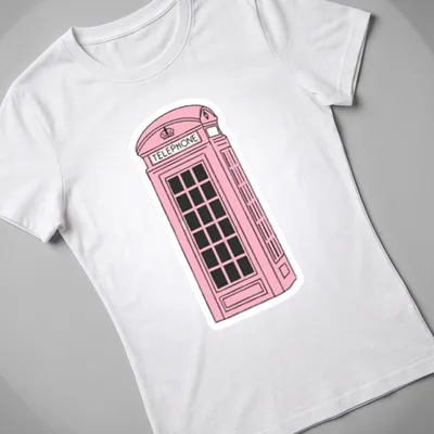 Illustration of a pink London phone booth with the word 'TELEPHONE' above it — printed on a women's shirt