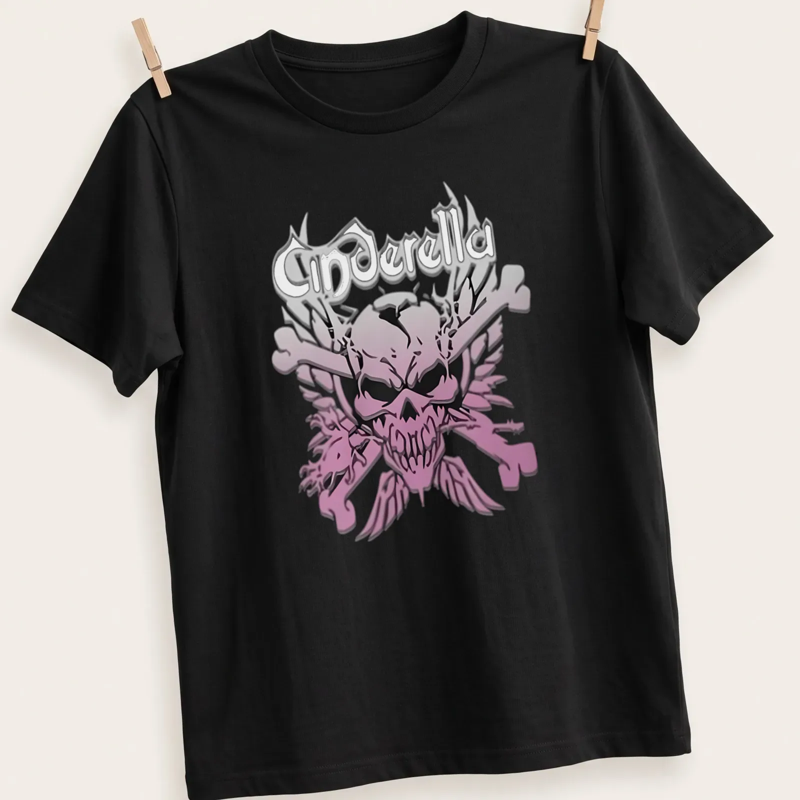 Gothic style t-shirt featuring Cinderella text with skull and crossbones in pink, black, and white. — printed on a unisex t-shirt