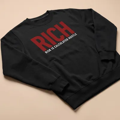 Bold typography t-shirt featuring the phrase 'Rich Risk Is Calculated Hustle' in maroon and white. — printed on a unisex sweatshirt