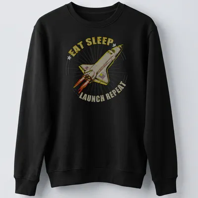 Vintage-style tee featuring a rocket and the text 'EAT SLEEP LAUNCH REPEAT' — printed on a unisex sweatshirt