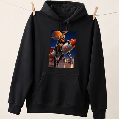 Realistic Rocket Woman graphic with Saturn in the background and bold 'H' text — printed on a unisex hoodie