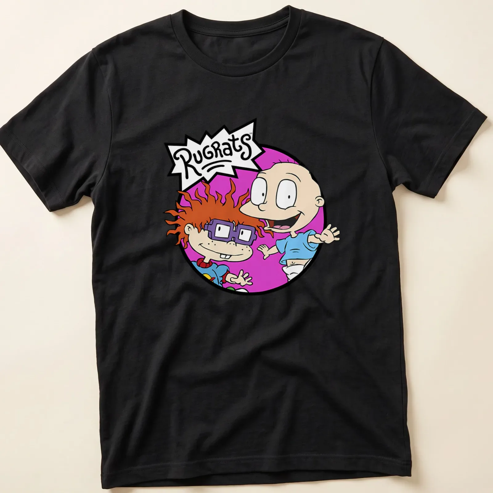Cartoon illustration of Chuckie and Tommy from Rugrats with colorful text. — printed on a unisex t-shirt