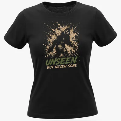 Sasquatch silhouette with splash art style and text 'Unseen But Never Gone.' — printed on a women's shirt