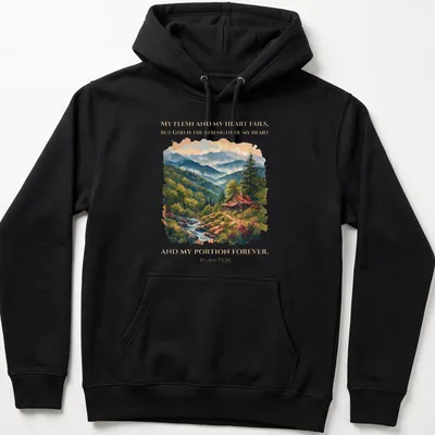 Realistic cabin landscape t-shirt with Psalm 73:26 printed text — printed on a unisex hoodie
