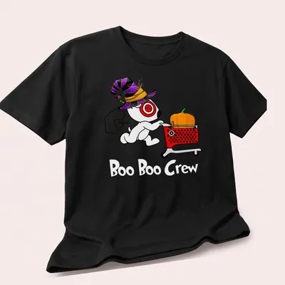 Cartoon dog in witch hat with pumpkin and shopping cart, text: Target Team Member — printed on a unisex t-shirt (angled view)