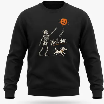 Playful cartoon skeleton dog chasing a pumpkin balloon with humorous text — printed on a unisex sweatshirt