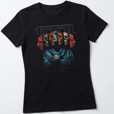 Abstract design of five skulls with glitter effect in multiple colors — printed on a women's shirt