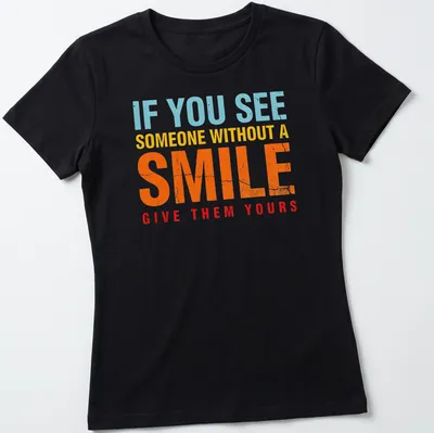 Bold colorful shirt with the phrase 'If you see someone without a smile, give them yours' — printed on a women's shirt