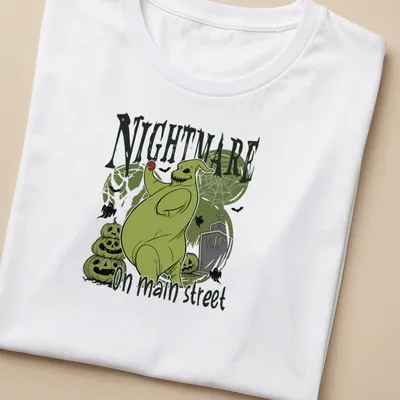 Illustrative horror design of a spooky green ghost with Halloween colors — printed on a women's shirt
