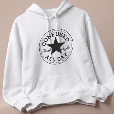 Circular badge with the text Confused Chuck Taylor All Day and a star graphic — printed on a unisex hoodie