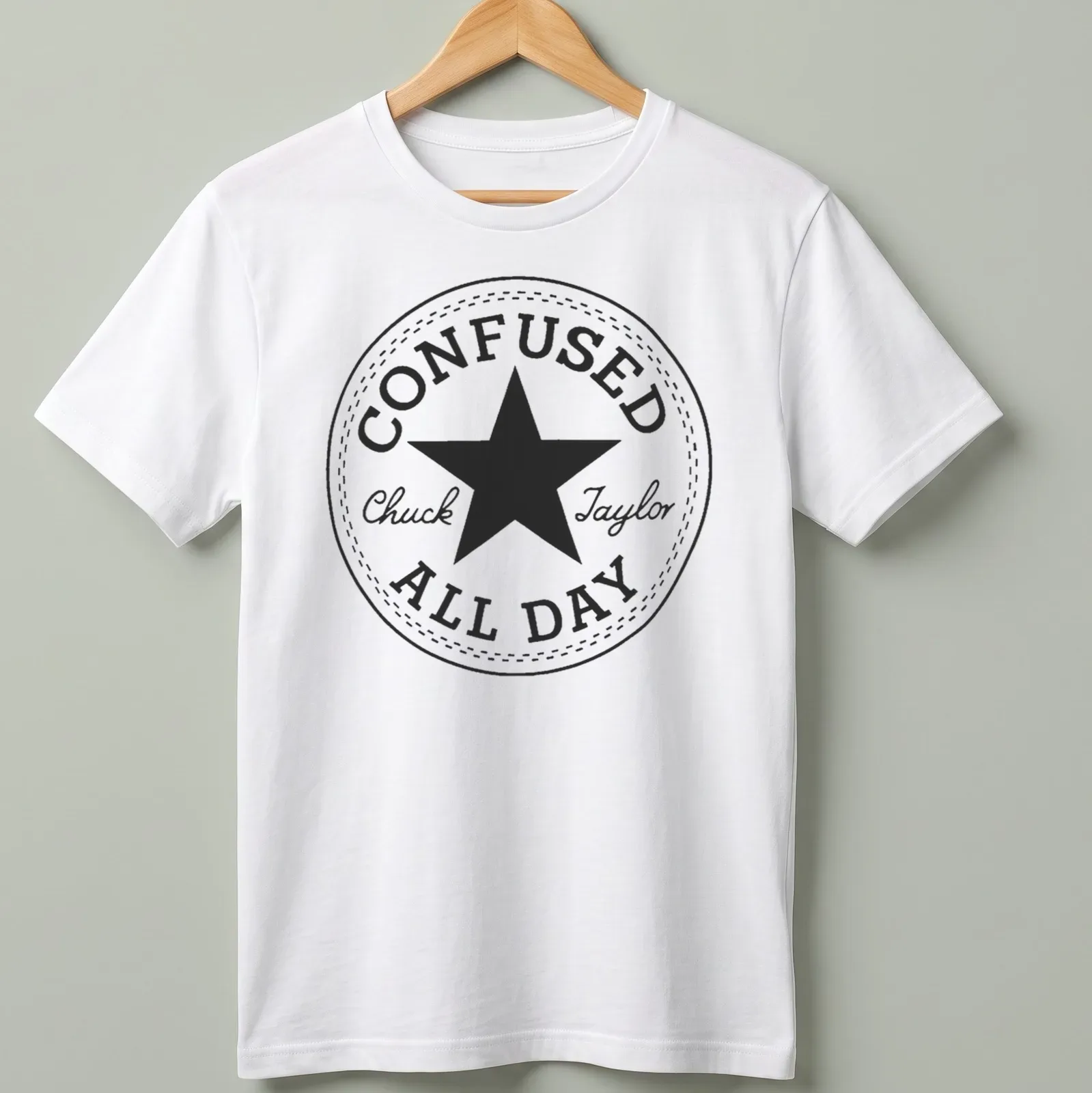 Circular badge with the text Confused Chuck Taylor All Day and a star graphic — printed on a unisex t-shirt