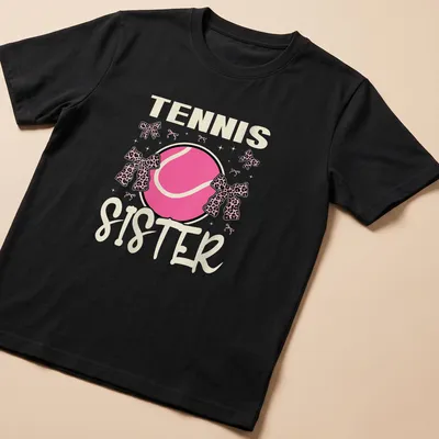 Colorful Tennis Sister t-shirt featuring a tennis ball with a pink bow