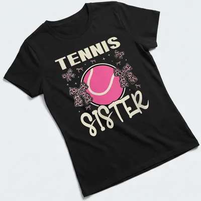 Colorful Tennis Sister t-shirt featuring a tennis ball with a pink bow — printed on a women's shirt
