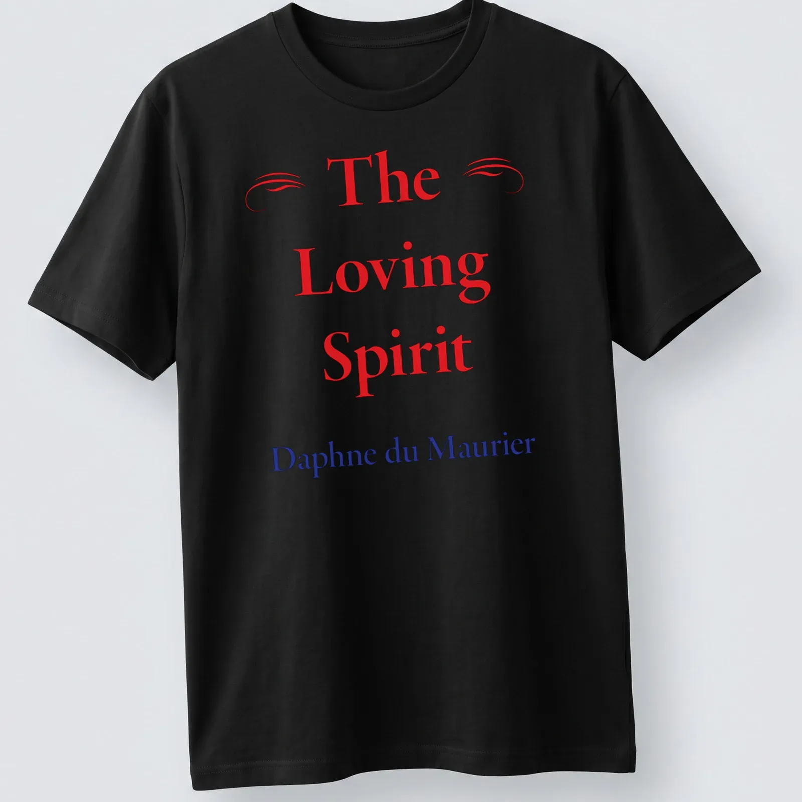 T-shirt featuring the name 'The Loving Spirit Daphne du Maurier' in red, blue, and white typography. — printed on a unisex t-shirt