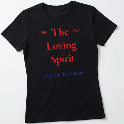 T-shirt featuring the name 'The Loving Spirit Daphne du Maurier' in red, blue, and white typography. — printed on a women's shirt