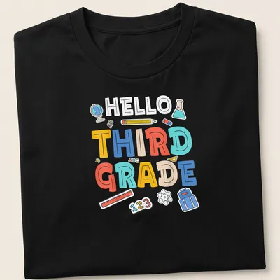 Colorful cartoon t-shirt with 'HELLO THIRD GRADE' and school supplies illustrations.