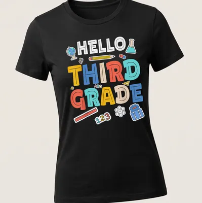 Colorful cartoon t-shirt with 'HELLO THIRD GRADE' and school supplies illustrations. — printed on a women's shirt