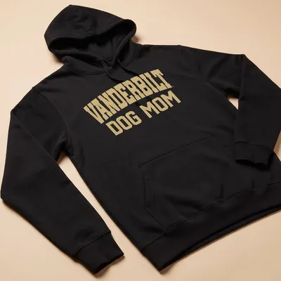 Bold collegiate style Vanderbilt Dog Mom t-shirt in gold and white. — printed on a unisex hoodie