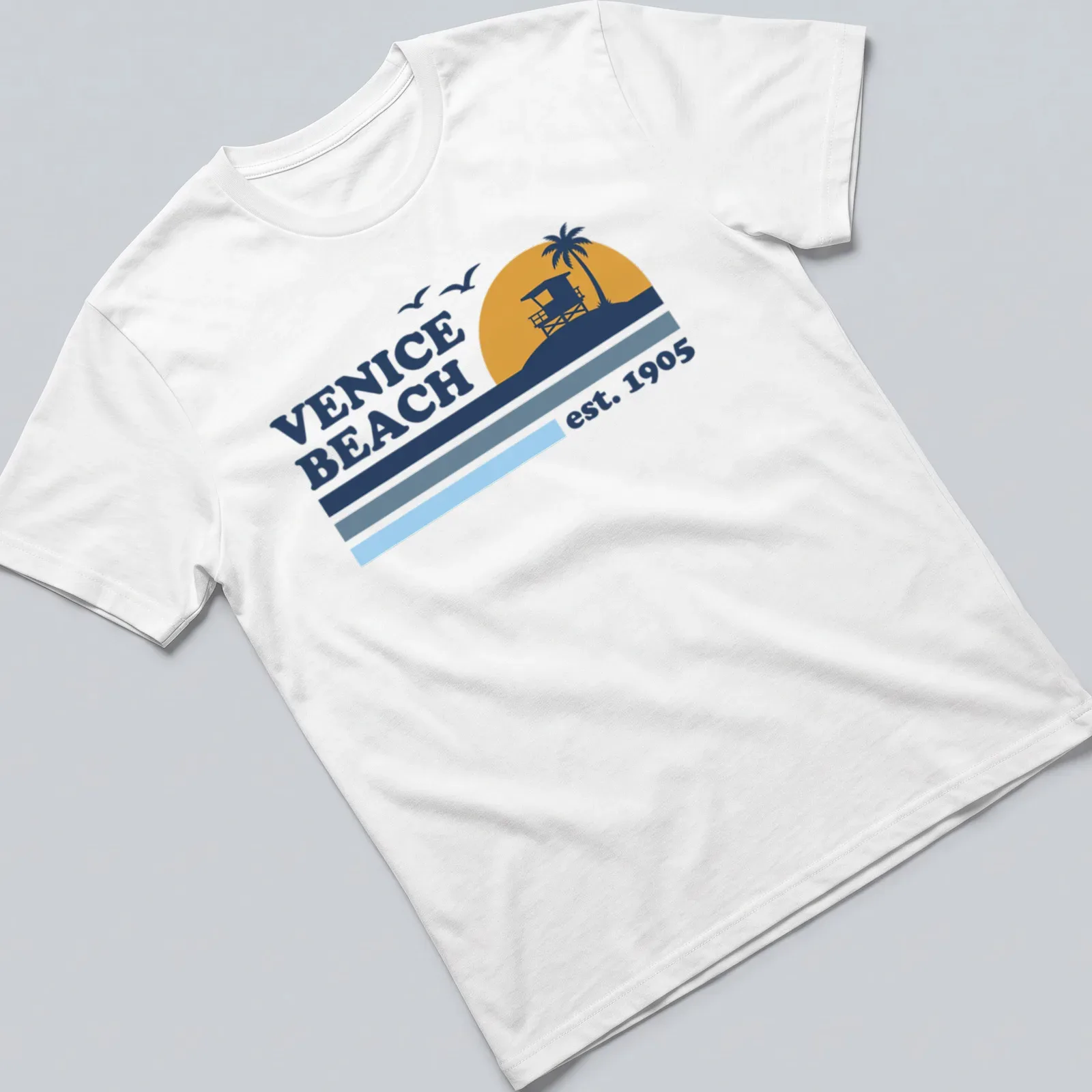 Vintage lifeguard tower graphic t-shirt with Venice Beach est. 1905 text — printed on a unisex t-shirt