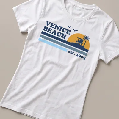 Vintage lifeguard tower graphic t-shirt with Venice Beach est. 1905 text — printed on a women's shirt