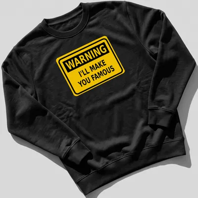 Bold graphic featuring a warning sign with humorous text about fame. — printed on a unisex sweatshirt