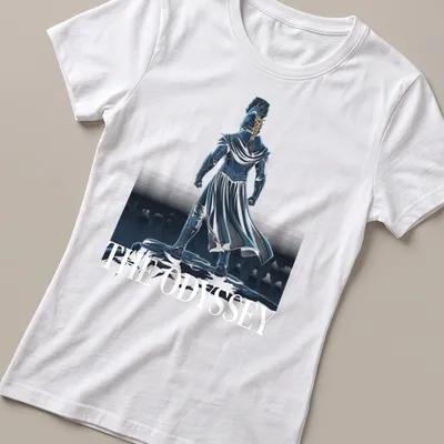 Detailed illustration of a warrior in armor atop a cliff with text: THE ODYSSEY — printed on a women's shirt