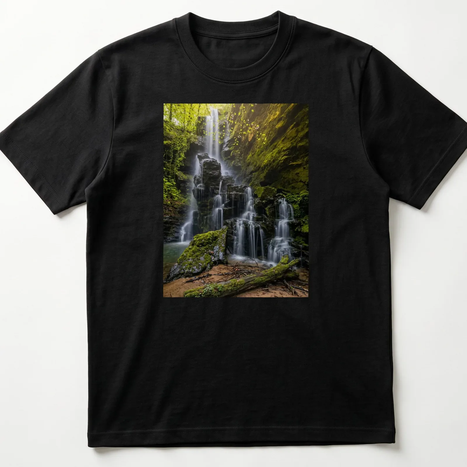 Photographic print of a waterfall surrounded by lush greenery in earthy tones — printed on a unisex t-shirt