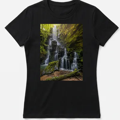 Photographic print of a waterfall surrounded by lush greenery in earthy tones — printed on a women's shirt
