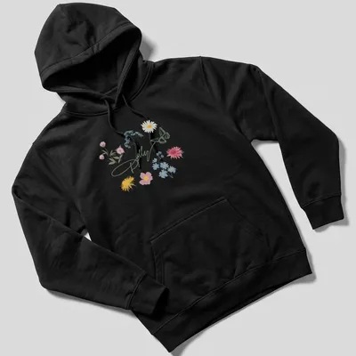 Illustrative T-shirt featuring the text 'Dolly' with wildflowers and a butterfly — printed on a unisex hoodie