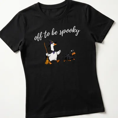 Cartoon of a witch goose walking a spider dachshund with spooky text — printed on a women's shirt