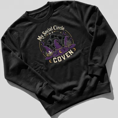 Vintage illustration of witch hats and hands with the text 'My Social Circle is a COVEN' in purple and gold. — printed on a unisex sweatshirt