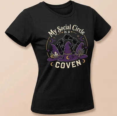 Vintage illustration of witch hats and hands with the text 'My Social Circle is a COVEN' in purple and gold. — printed on a women's shirt