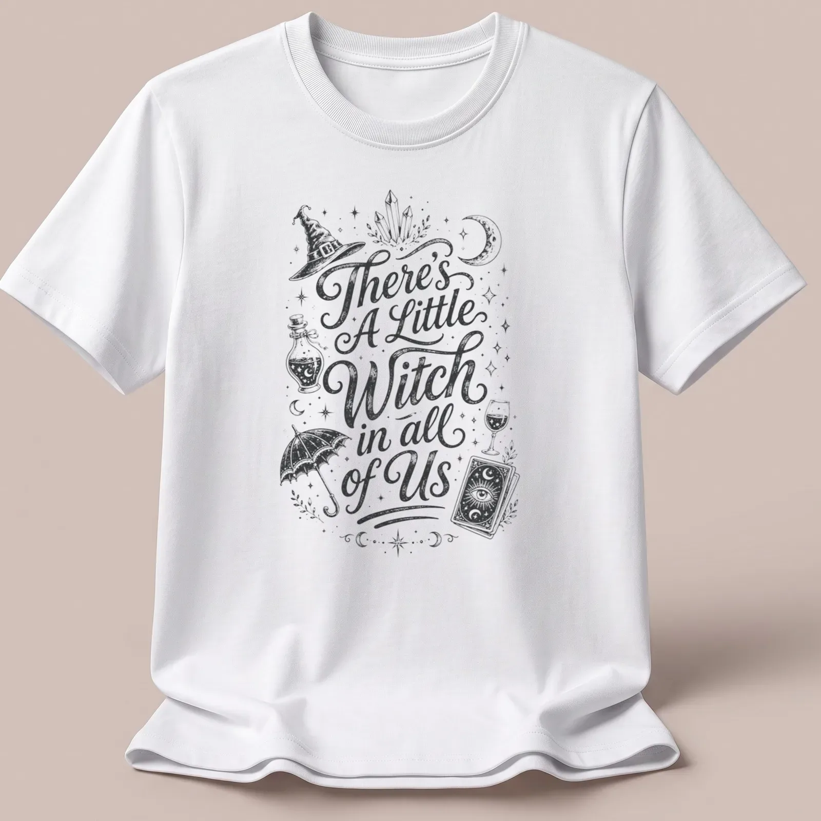 Vintage hand-drawn t-shirt featuring 'There's A Little Witch in all of Us' with witchcraft elements — printed on a unisex t-shirt