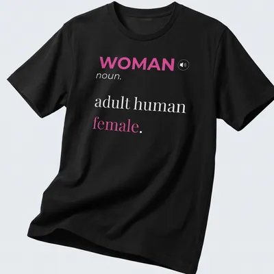 Modern typography t-shirt featuring 'WOMAN noun. adult human female.' in pink and white.