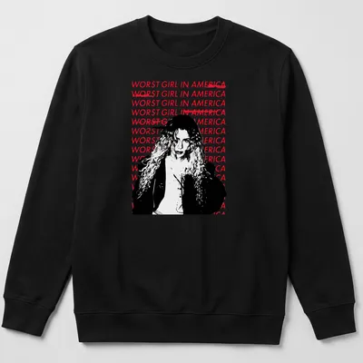 Bold graphic tee featuring the text 'WOR$T GIRL IN AMERICA' with an illustration of a woman with curly hair. — printed on a unisex sweatshirt
